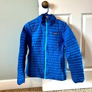 Patagonia light down puffy jacket, size small, color blue, good used condition.